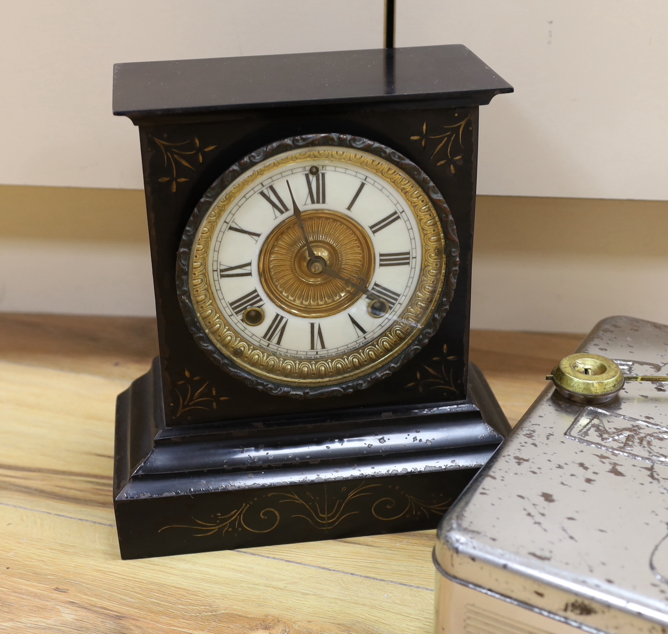 A black slate clock, tinned Monopoly game, old bottles, cigarette boxes and mixed collectables